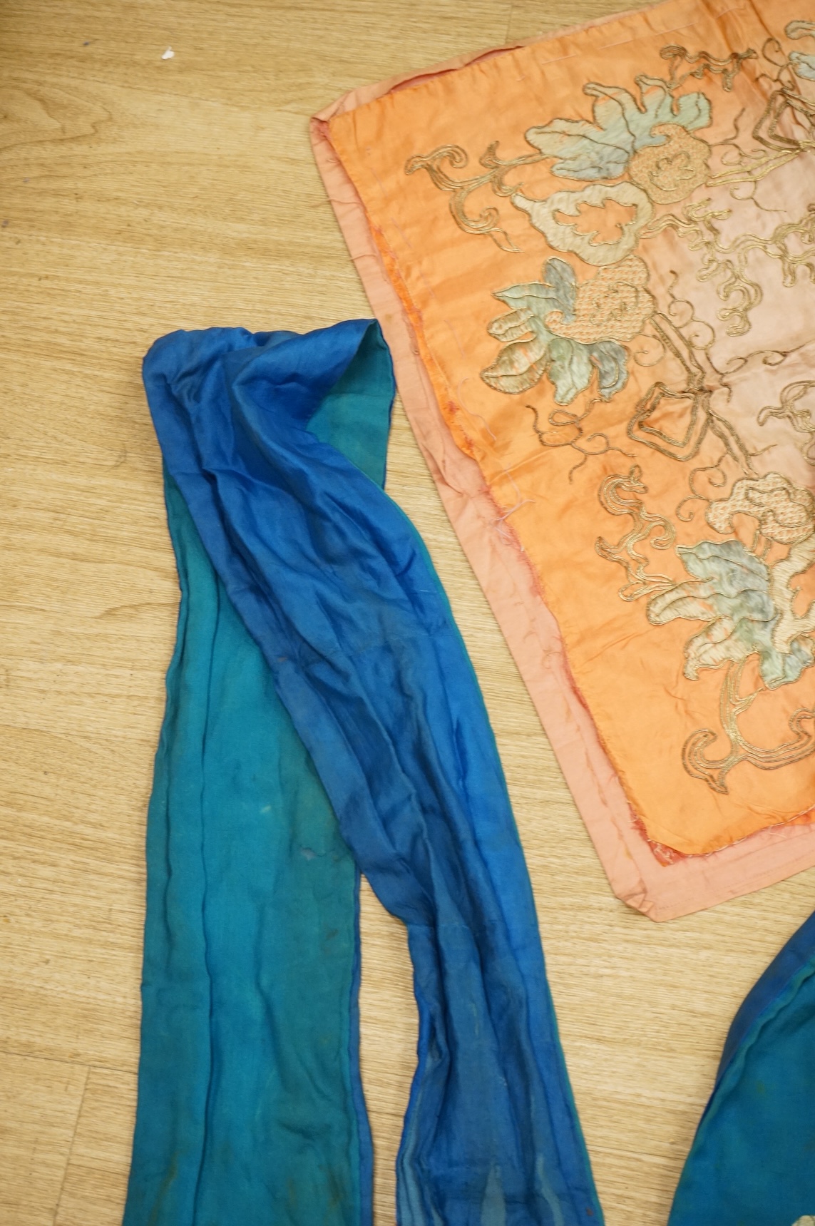 A collection of Chinese and Japanese embroidered kimonos and textiles
